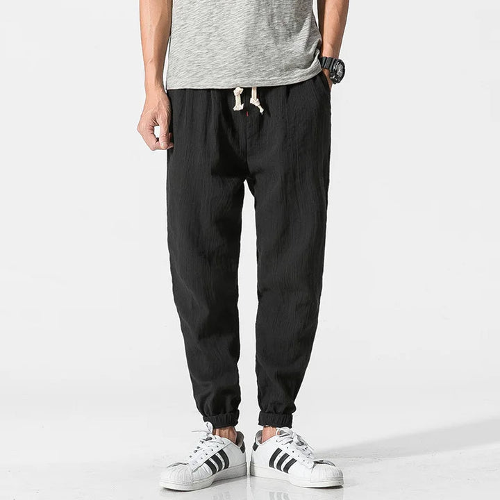 Man wearing relaxed fit tapered joggers, perfect for comfort, casual outings, or home loungewear.