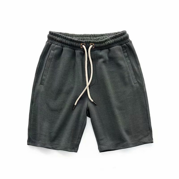 Comfortable men's terry shorts with drawstring, relaxed fit, ideal for loungewear or summer activities.