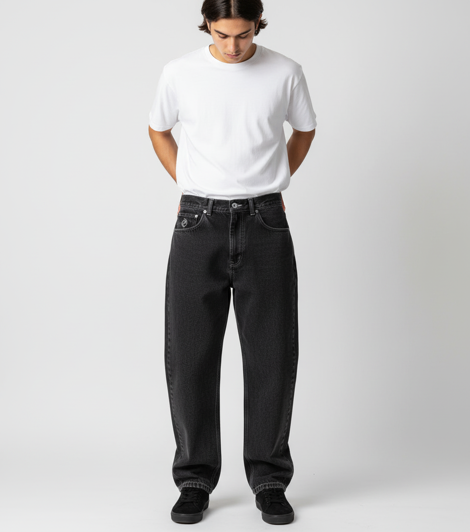 Man walking, showcasing the comfortable movement in relaxed fit urban skate jeans.