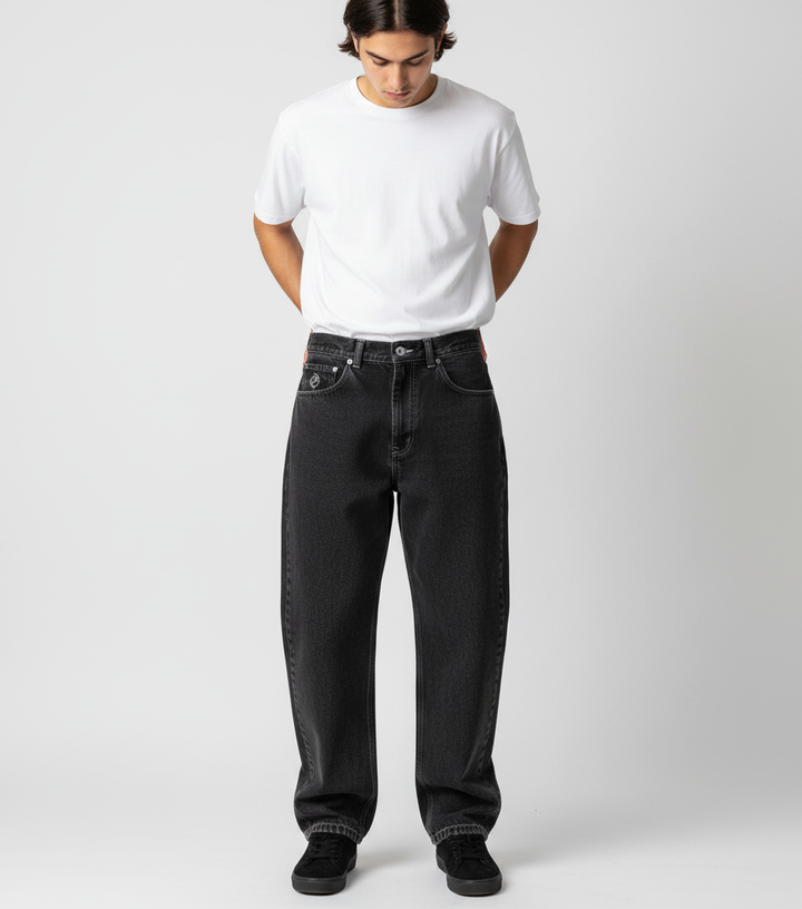 Man walking, showcasing the comfortable movement in relaxed fit urban skate jeans.