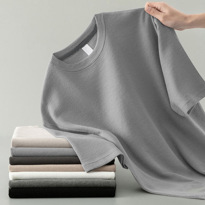Comfortable men's everyday waffle knit tee, relaxed fit. Versatile long sleeve layering piece for casual style.