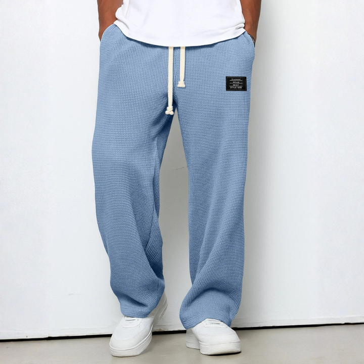 Men's relaxed fit waffle knit trousers in a comfortable, casual loungewear style.