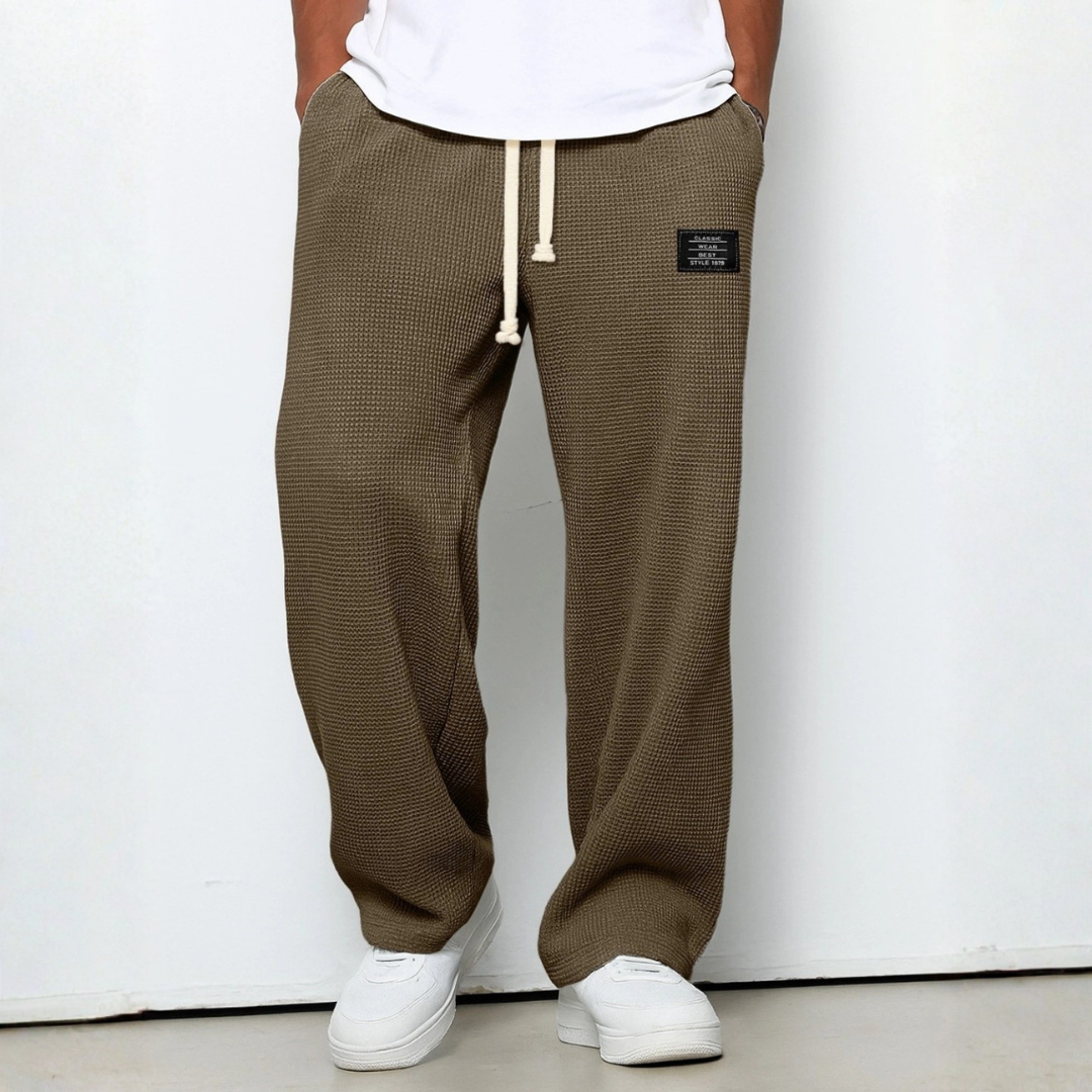 Relaxed fit men's knit pants, waffle texture, offering supreme comfort and casual style.