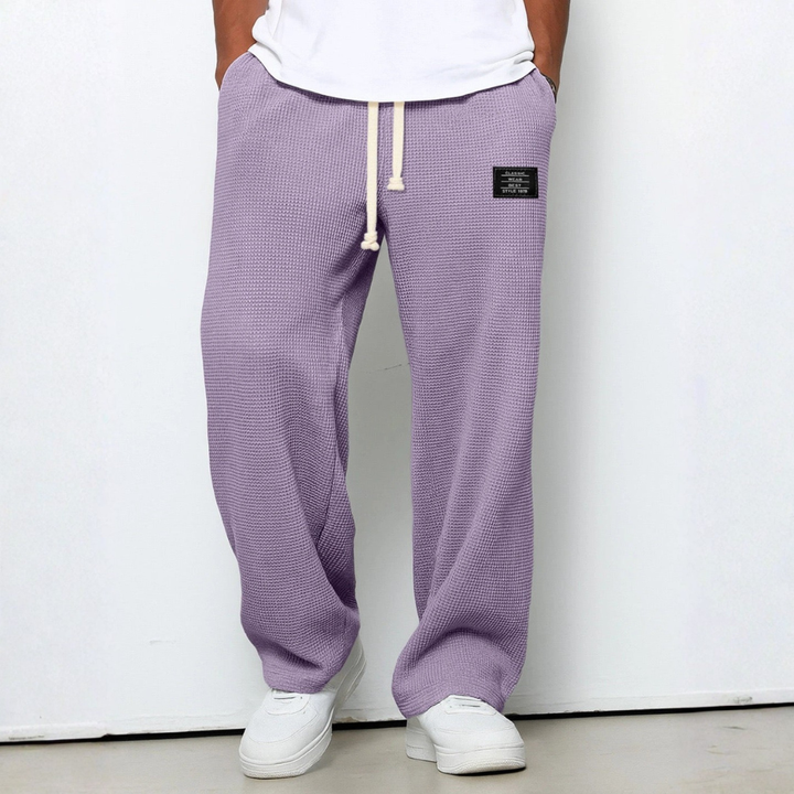 Textured men's waffle knit trousers, relaxed fit, stylish and comfortable casual pants.