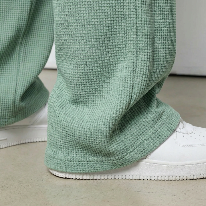 Stylish men's casual pants, relaxed fit waffle knit, featuring a comfortable drawstring waist.