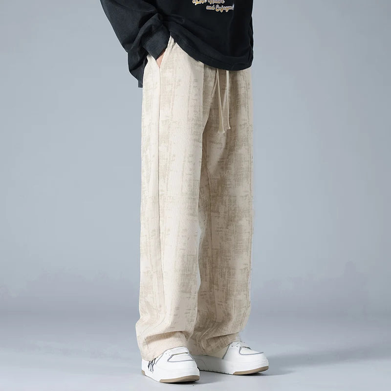 Modern men's fashion: wide-leg jogger pants with a relaxed fit. Great for active lifestyle & comfort.