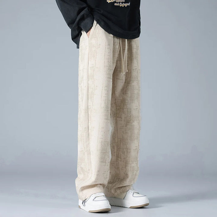 Modern men's fashion: wide-leg jogger pants with a relaxed fit. Great for active lifestyle & comfort.