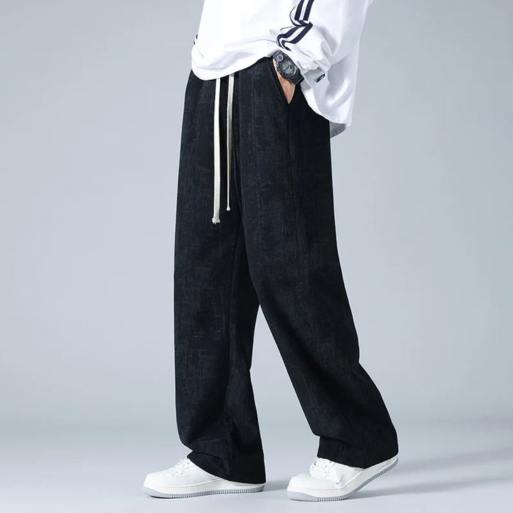 Men's comfort wear: wide-leg joggers with drawstring for a relaxed, modern casual style.