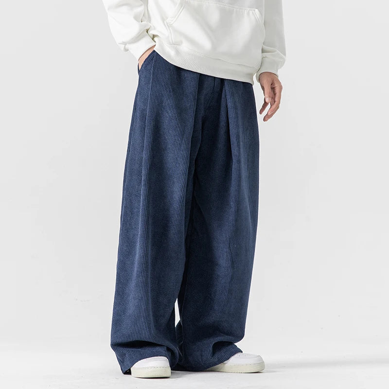 Men's relaxed fit wide-leg trousers for comfortable daily wear. Casual drawstring pants, versatile fashion.