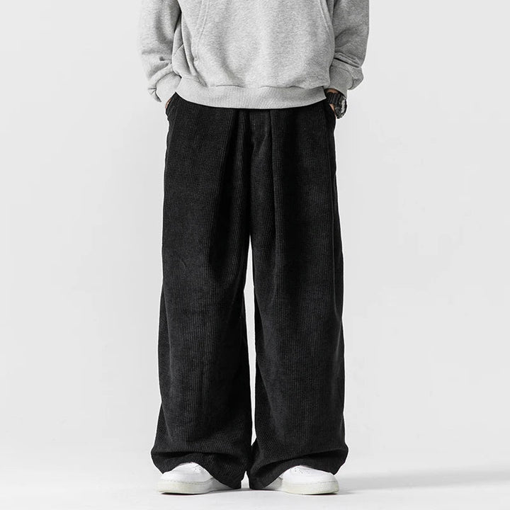 Versatile men's wide-leg trousers, relaxed fit for casual daily wear. Stylish drawstring pants for comfort.