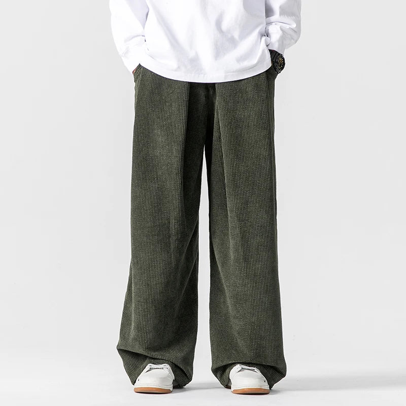 Loose fit men's wide-leg trousers, modern casual pants. Relaxed silhouette for comfortable daily fashion.