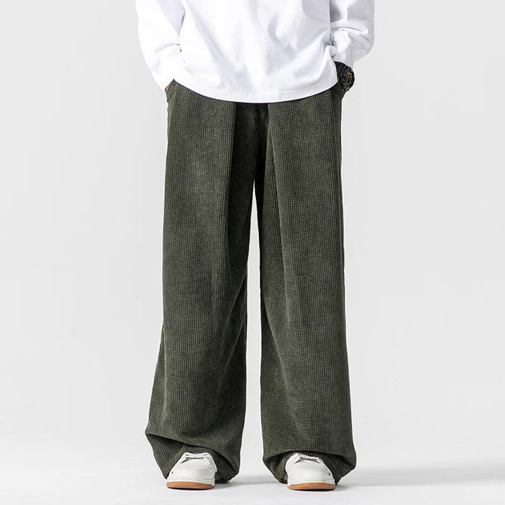 Loose fit men's wide-leg trousers, modern casual pants. Relaxed silhouette for comfortable daily fashion.