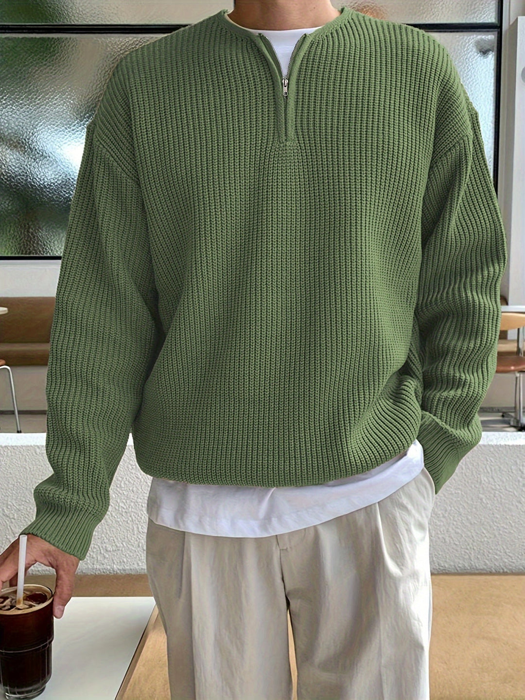 Cozy men's striped knitted pullover with half-zip, perfect for modern casual wear.