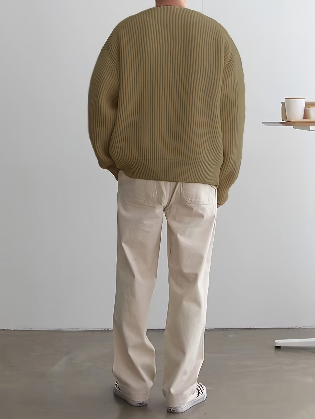 Relaxed fit men's striped sweater, a comfortable half-zip pullover for everyday style.