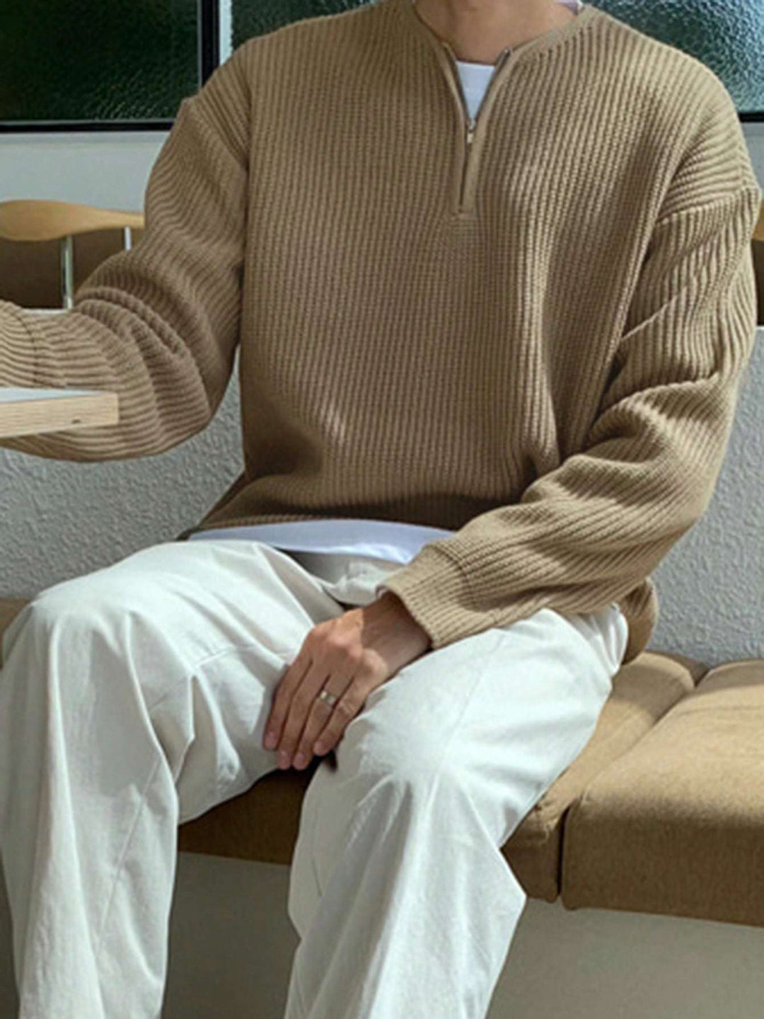 Comfortable men's long sleeve striped pullover with half-zip for relaxed daily wear.