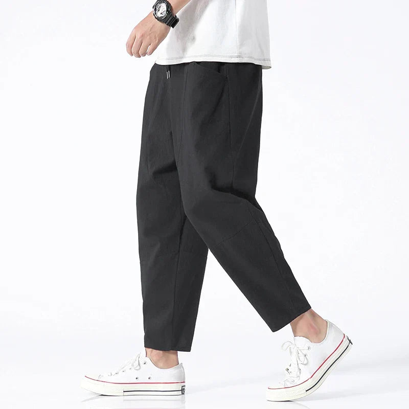 Comfortable men's cropped pants with drawstring, relaxed tapered fit for everyday comfort.
