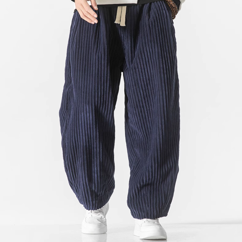 Modern men's wide-leg joggers with a relaxed fit and adjustable drawstring waist for loungewear.