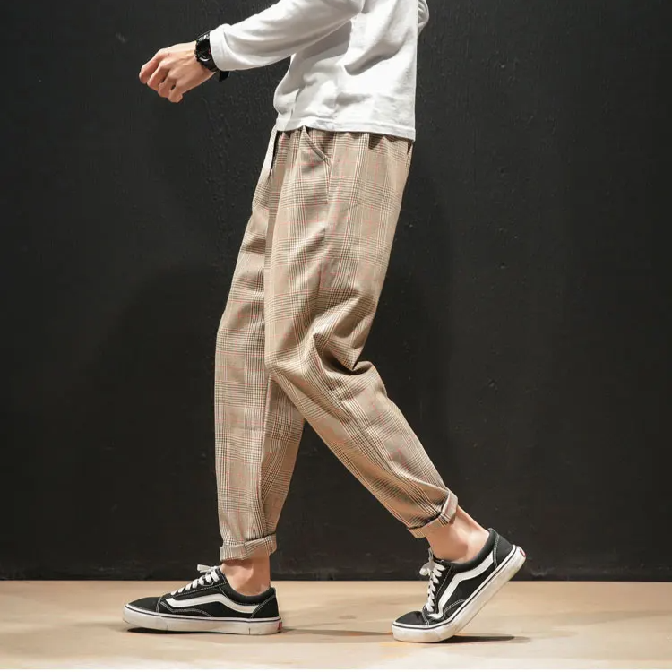 Men's plaid pants paired with a blazer, showing their formal versatility and sophisticated modern style.