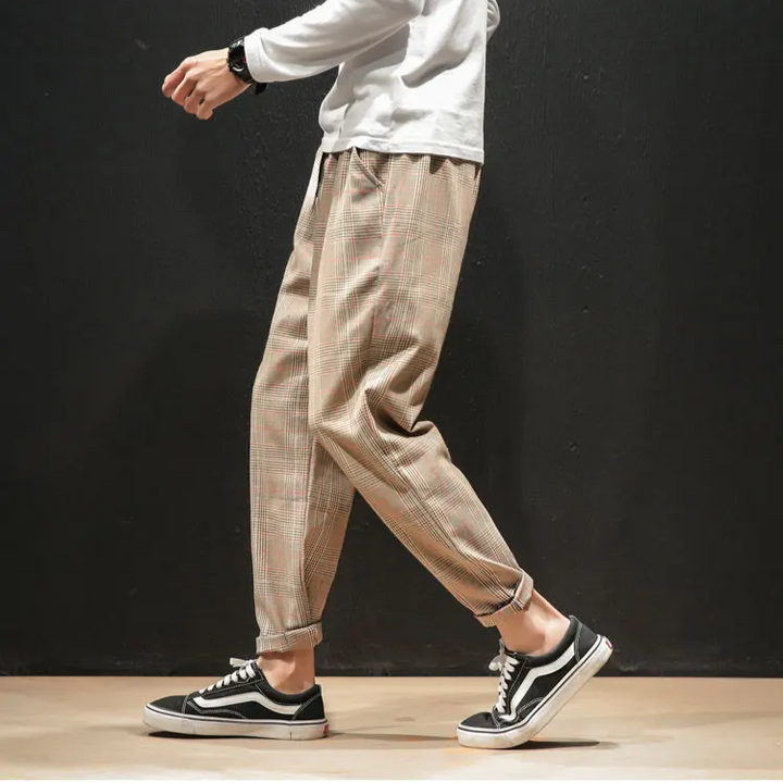Men's plaid pants paired with a blazer, showing their formal versatility and sophisticated modern style.