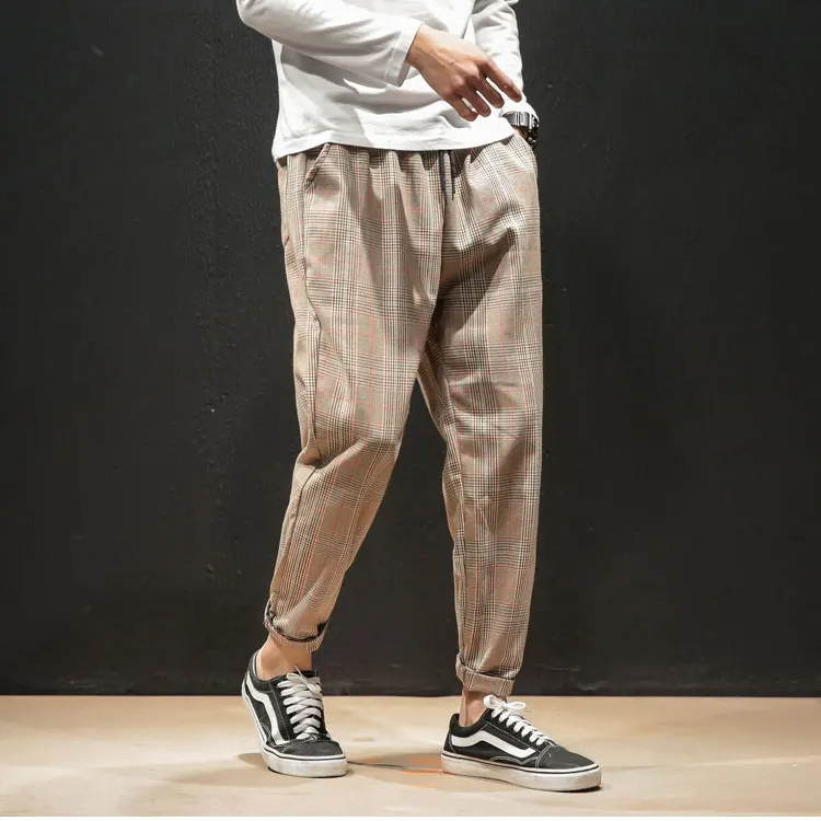 Modern men's apparel: comfortable, stylish plaid bottoms with stretch and a versatile tapered fit.