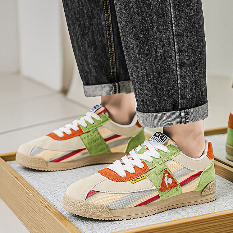 Multi-color men's retro sneakers with a classic low-cut design, combining track style & streetwear appeal.
