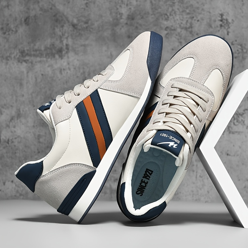 Stylish men's retro striped athletic sneakers. Perfect casual footwear for men's fashion.