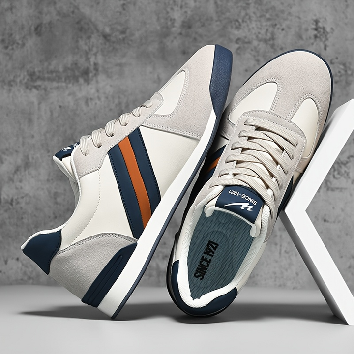 Stylish men's retro striped athletic sneakers. Perfect casual footwear for men's fashion.