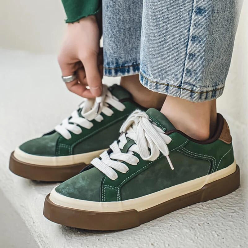Green men's retro vintage sneakers with white laces, perfect for casual everyday style and comfort.