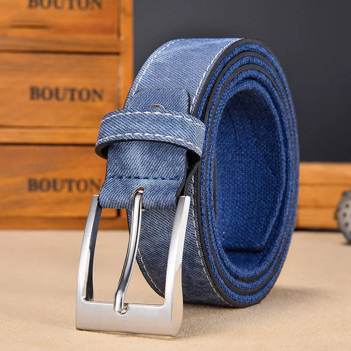Durable men's reversible belt with blue denim-look and classic black canvas side.