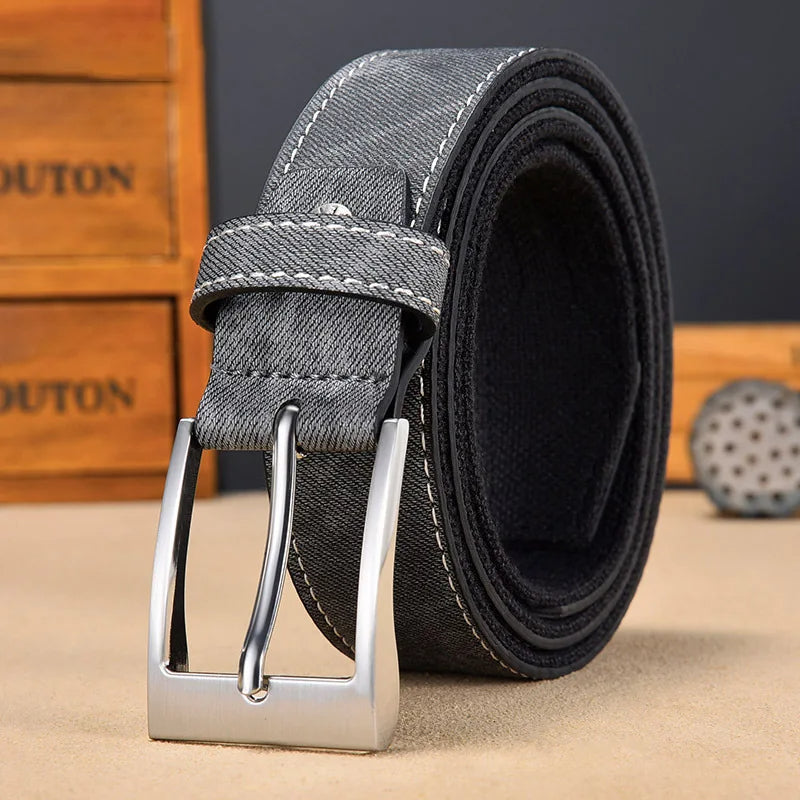 Close-up of men's denim-look casual belt, showcasing its unique texture and sturdy buckle.