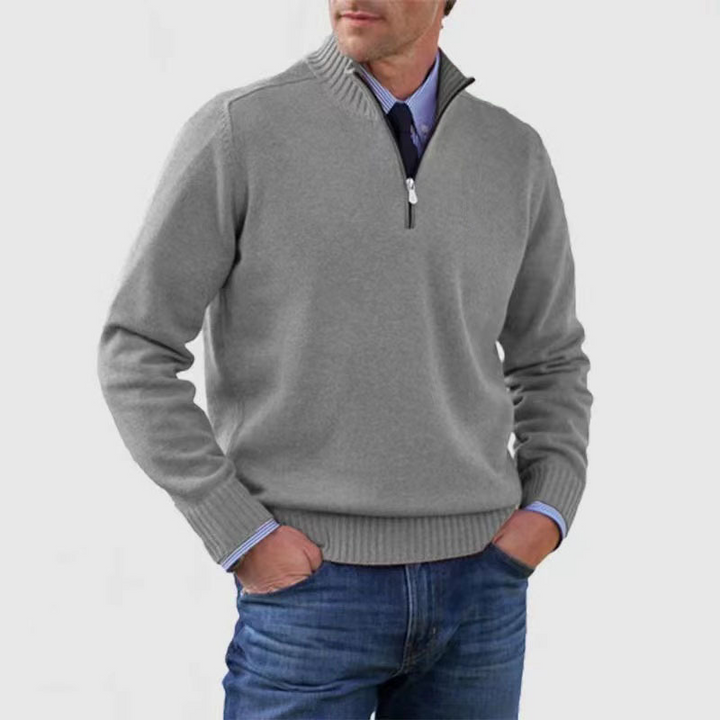 Men's ribbed half-zip mock neck sweater in a versatile color, ideal for elegant layering and comfort.