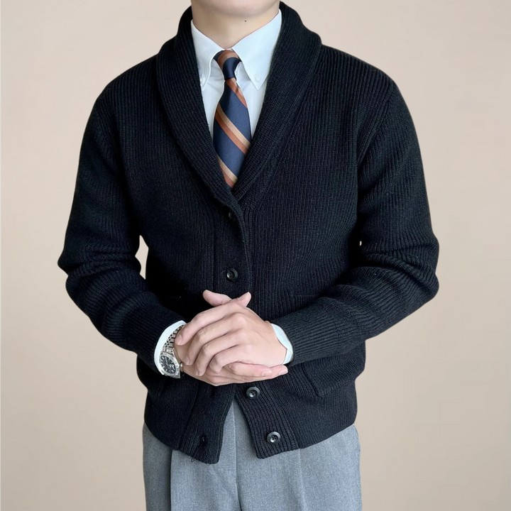 Close-up of a men's chunky ribbed knit cardigan sweater featuring a warm shawl collar, great for winter comfort.