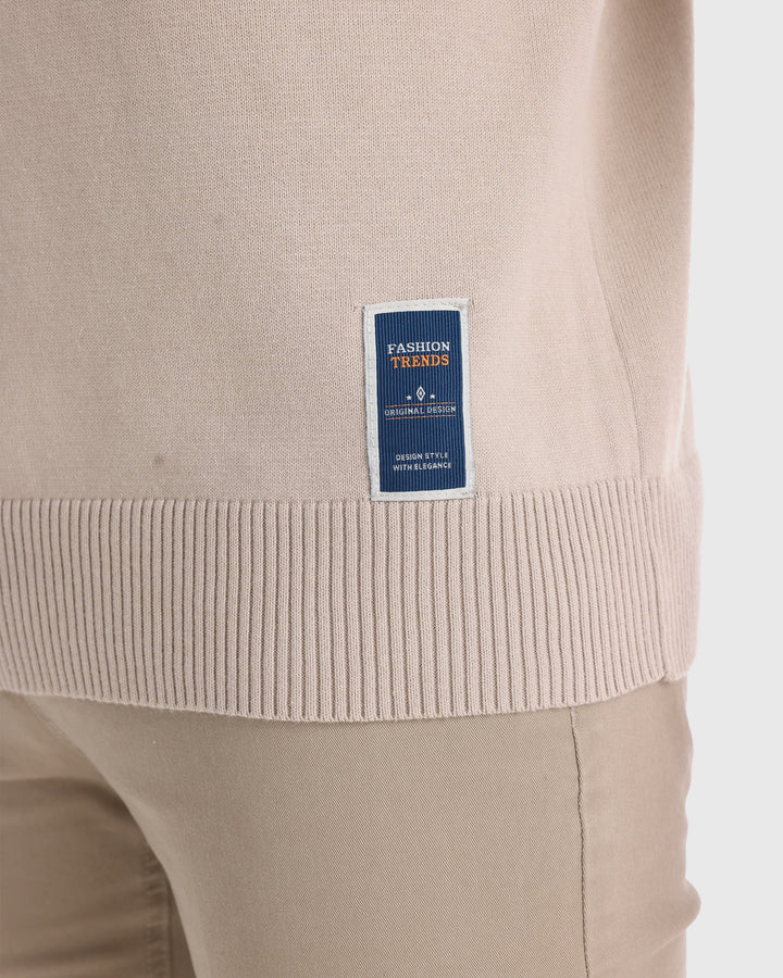 Man wearing a long sleeve ribbed V-neck sweater, styled for a polished everyday look.