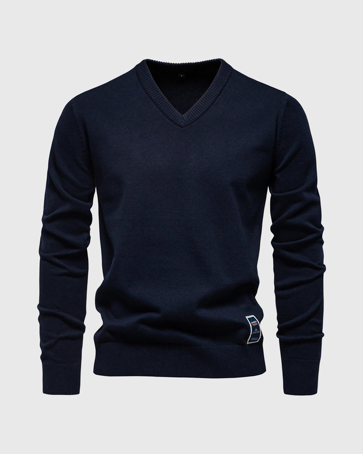 Polished men's ribbed V-neck sweater, slim fit, suitable for smart casual office attire.