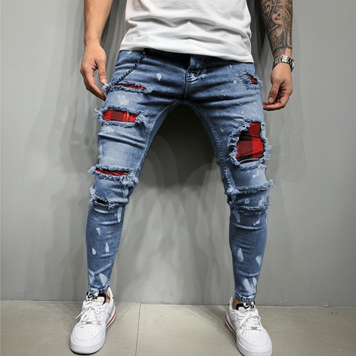 Stylish men's ripped slim fit jeans with assorted fabric patches, perfect for casual menswear.