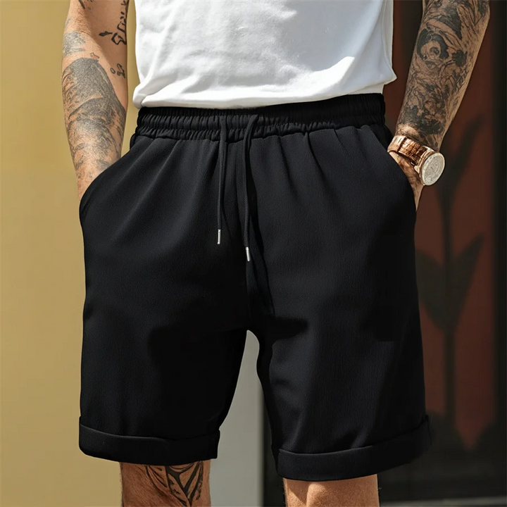 Stylish men's cuffed shorts, Riviera design, lightweight fabric, ideal for warm weather comfort & style.
