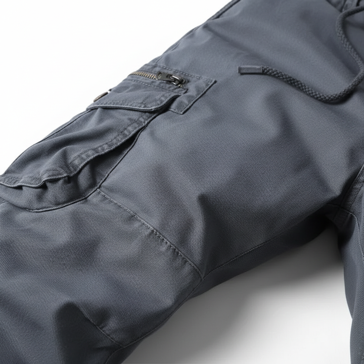 Close-up of men's robust cotton cargo pants fabric texture, showcasing durability and quality.