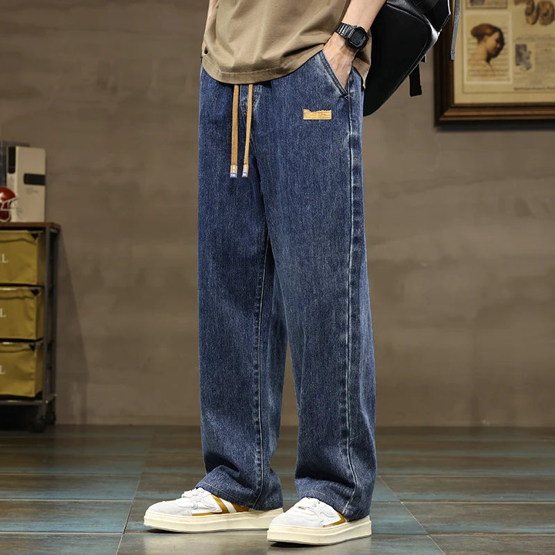 Men's Rogue style denim joggers with drawstring waist, wide leg, and relaxed fit for ultimate comfort.