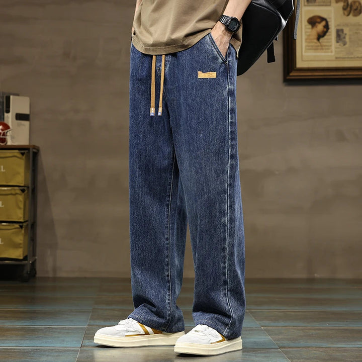 Men's Rogue style denim joggers with drawstring waist, wide leg, and relaxed fit for ultimate comfort.