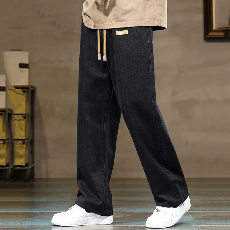 Men's apparel: Rogue style denim joggers, comfortable, wide leg, relaxed fit, and drawstring waist.