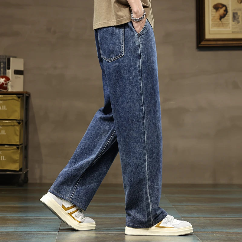 Comfortable men's denim style jogger pants, perfect for streetwear or lounge, featuring a drawstring.