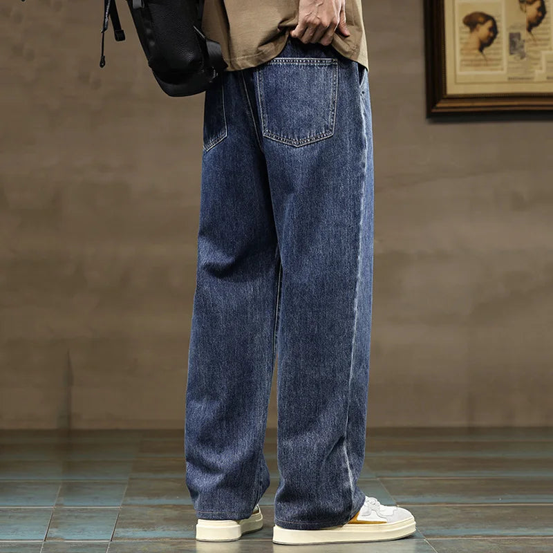 Casual men's wide-leg denim joggers with relaxed fit and drawstring, ideal for everyday comfort.