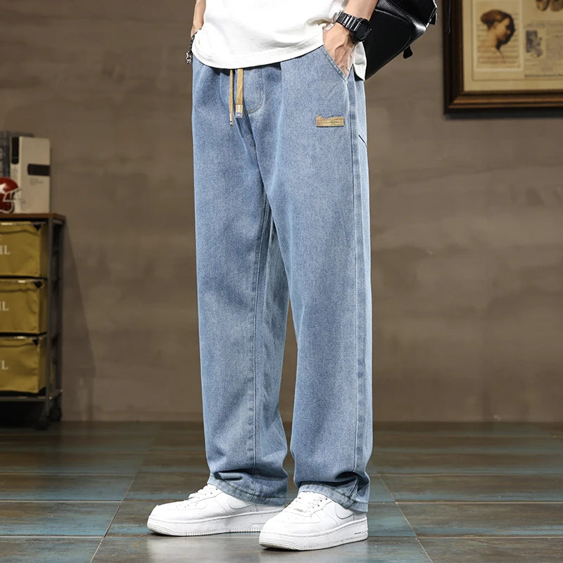 Rogue style men's apparel: denim jogger pants with a comfortable drawstring waist and wide leg.