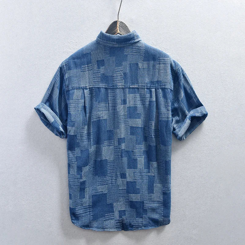 Black men's rugged style button-up long-sleeve shirt. Casual, multi-pocket design for versatile everyday fashion.