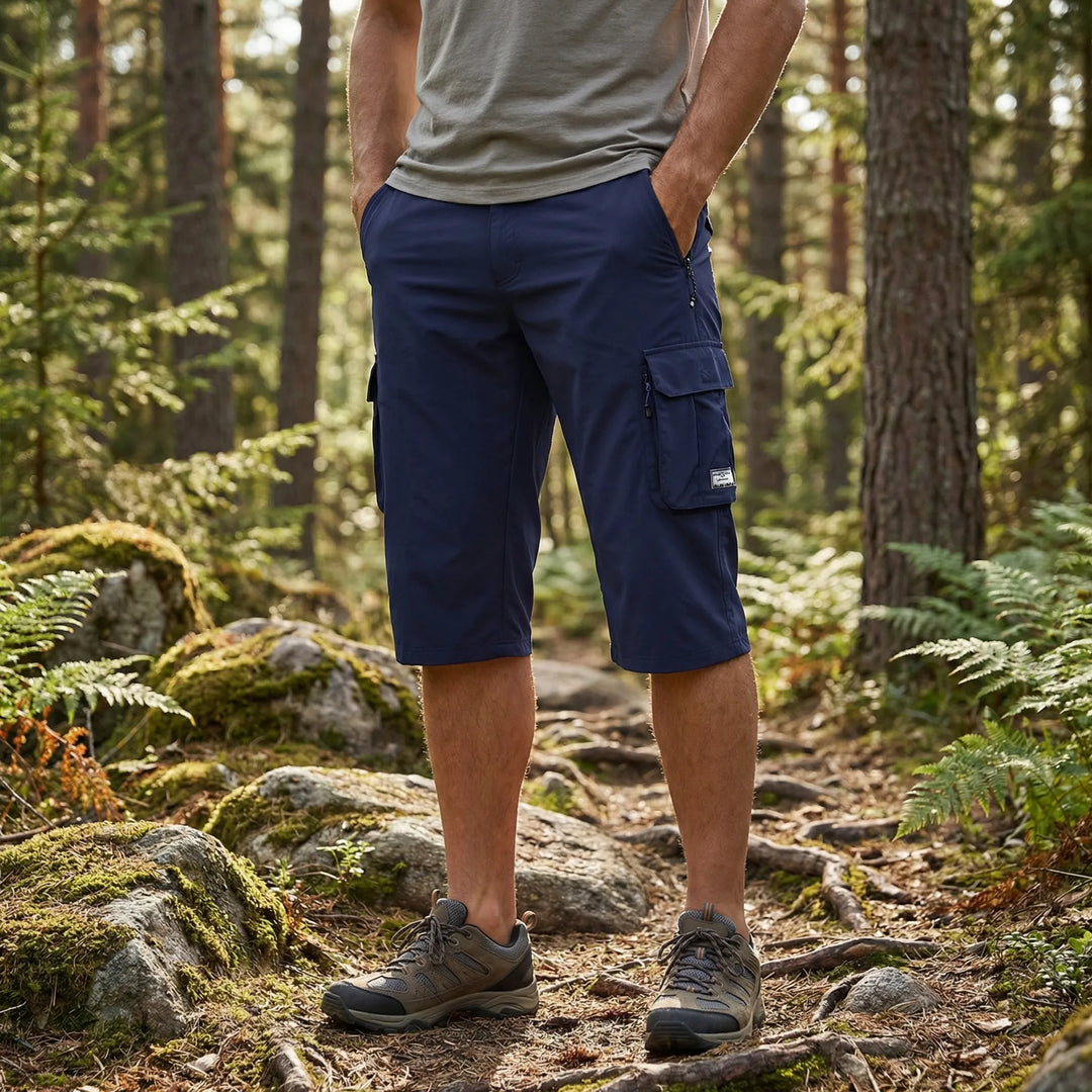 Men's rugged cargo shorts in green, featuring multiple utility pockets for outdoor adventures & hiking.