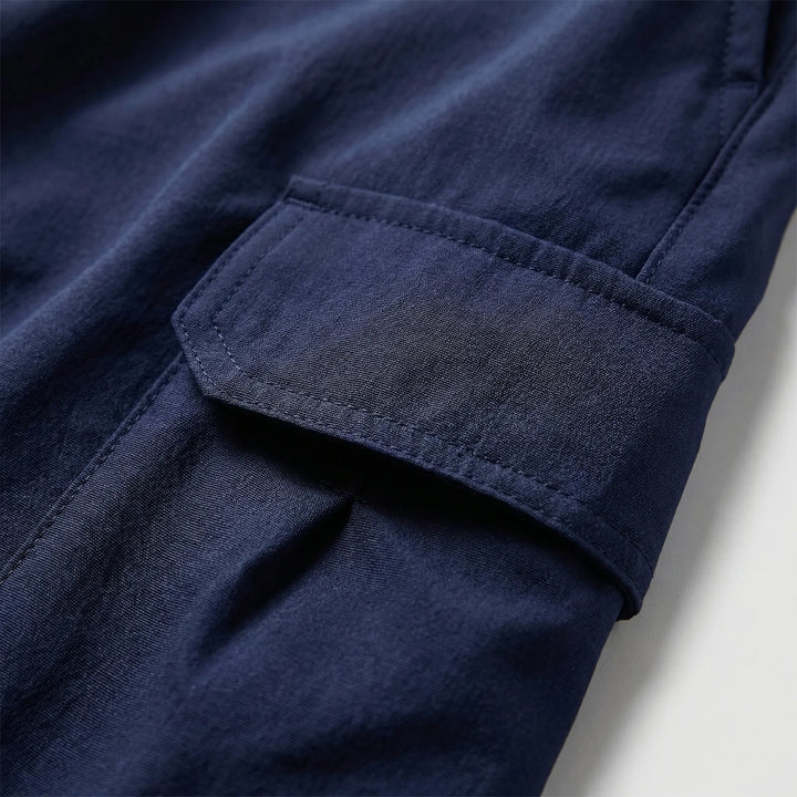 Durable men's utility shorts with multi-purpose pockets, perfect for outdoor activities & active wear.