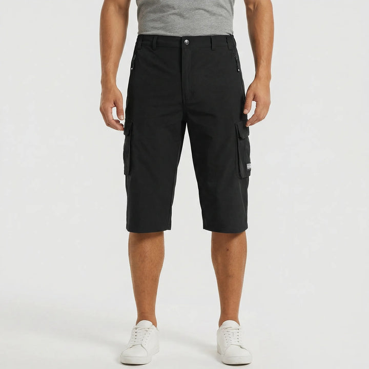 Heavy-duty men's cargo shorts for outdoor wear, equipped with multiple utility pockets & quick-dry fabric.