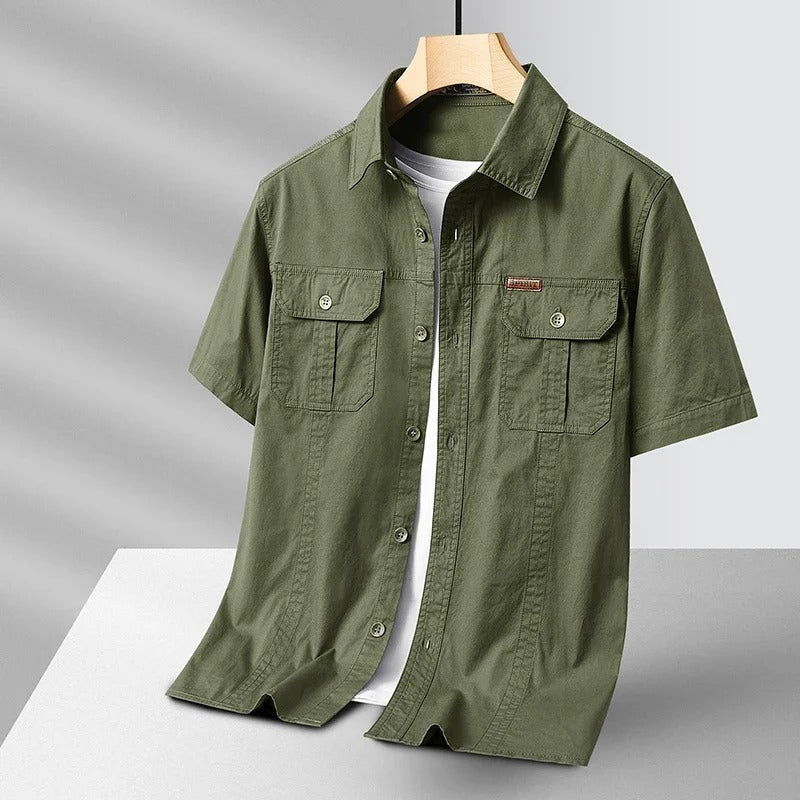 Durable men's short sleeve shirt made from rugged cotton. Ideal for utility, adventure, and daily casual wear.