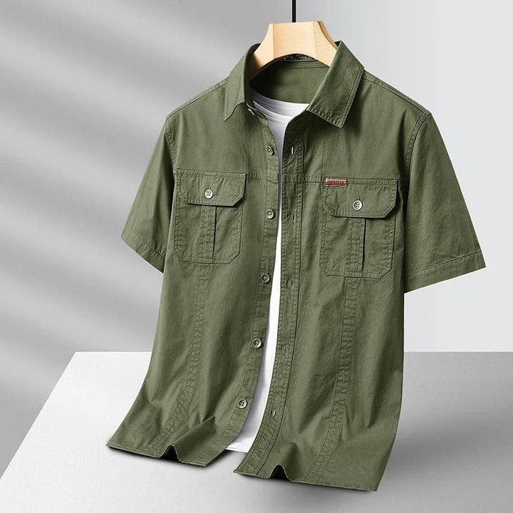 Durable men's short sleeve shirt made from rugged cotton. Ideal for utility, adventure, and daily casual wear.
