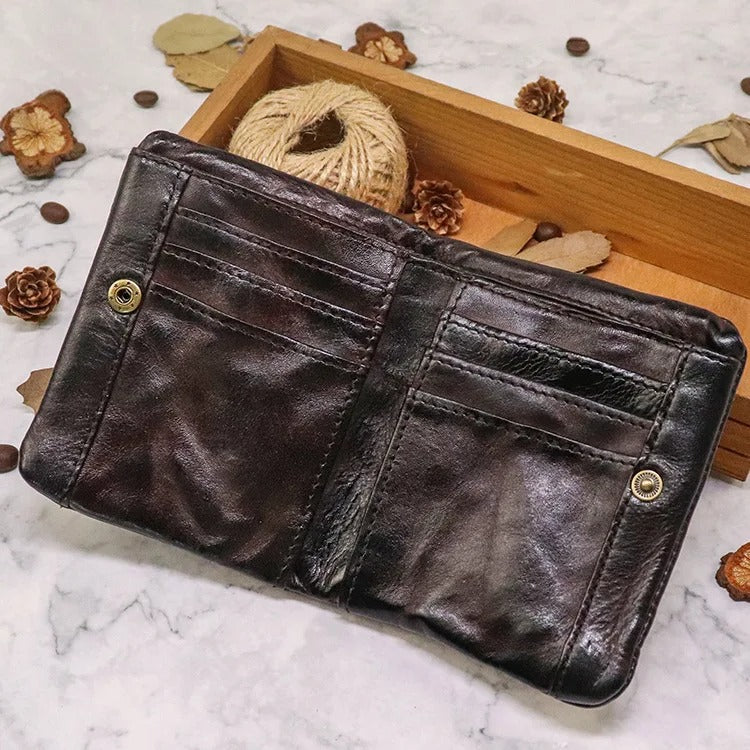 Close-up of the rugged texture on a men's distressed leather bifold wallet.